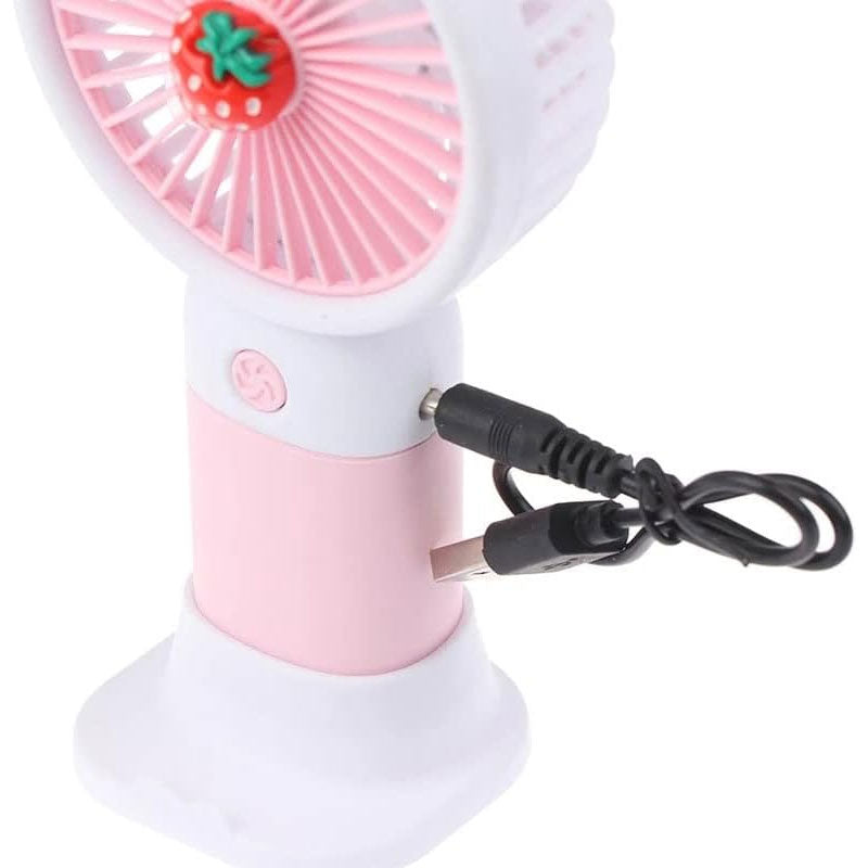 Pink and white fan with strawberry design on a white background